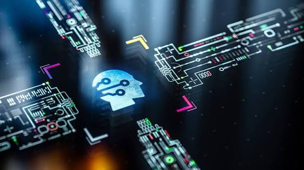 A glowing blue AI head icon at the center of interlocking circuit-board pathways in blue, yellow and pink, on a dark server-room background