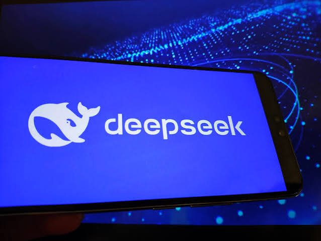 Smartphone screen showing the DeepSeek whale logo and wordmark against a blue digital background