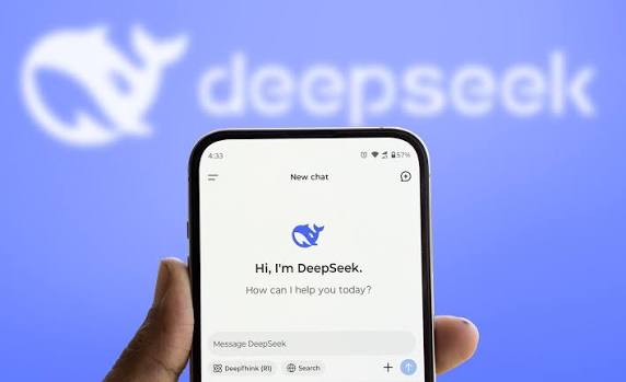 A red DeepSeek whale silhouette breaching over a falling price curve on a black field, representing cheap frontier-grade coding