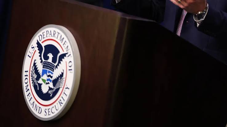 U.S. Department of Homeland Security seal on a podium as an official speaks