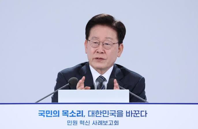 South Korean President Lee Jae Myung speaks at a podium during a government briefing in Seoul
