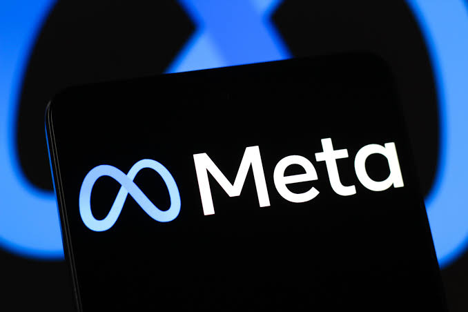 The Meta logo on a desktop computer screen, representing an open-weight AI model running locally on consumer hardware