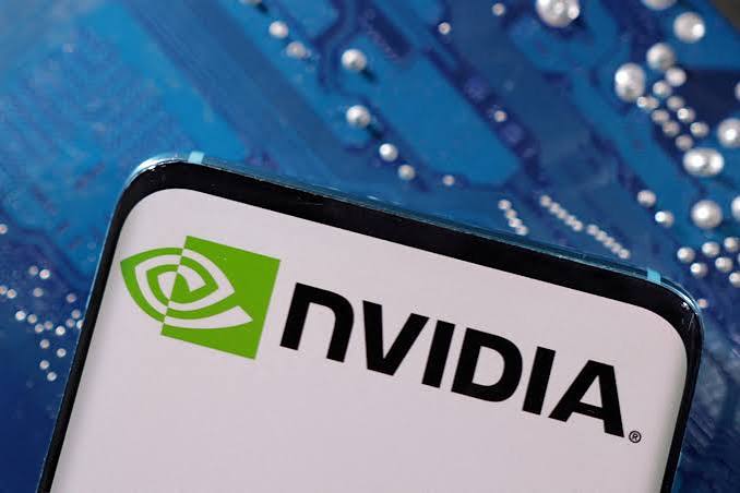 The Nvidia logo on a smartphone screen placed on a blue computer circuit board