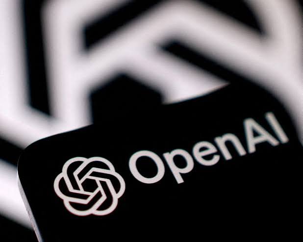 Editorial illustration of a locked red server room door with lines of code visible through a narrow window, representing OpenAI pausing its Astra model over a critical cybersecurity risk