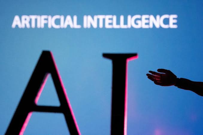 An artificial intelligence sign with a human hand reaching toward it