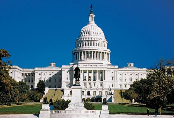 The United States Capitol building in Washington under a clear blue sky