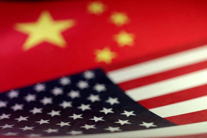 Chinese and United States flags overlapping, illustrating US-China relations