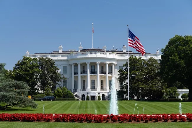 The White House south lawn with American flag